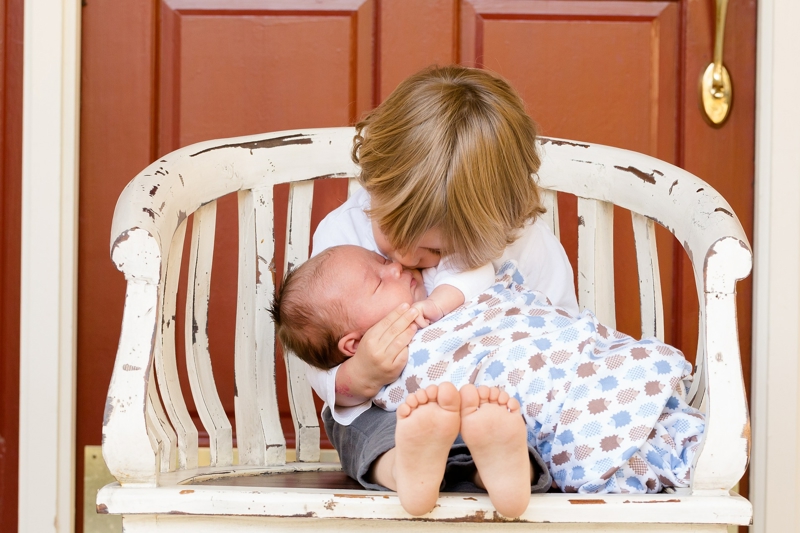 Can co-breastfeeding my first child and my newborn affect colostrum production?