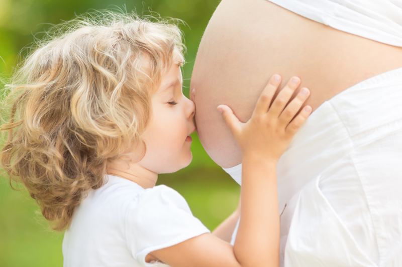 Are there any risks for my child if I breastfeed during pregnancy?